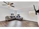 Bright living room with hardwood floors, ceiling fan, and comfortable seating at 382 Gracious Way, Henderson, NV 89011