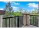 This balcony offers views of green trees and blue skies on a beautiful sunny day at 41 Via Verso Lago, Henderson, NV 89011