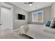 Comfortable bedroom featuring a TV, bright windows with blinds, carpet, and neutral walls at 41 Via Verso Lago, Henderson, NV 89011