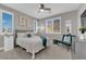 Well-lit bedroom showcasing bright windows with blinds, carpet, neutral walls, and comfortable furnishings at 41 Via Verso Lago, Henderson, NV 89011