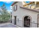 Stylish home features a stucco exterior with decorative arches and a private entrance at 41 Via Verso Lago, Henderson, NV 89011