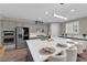 This expansive kitchen showcases white countertops, modern stainless steel appliances, and sleek gray cabinets at 41 Via Verso Lago, Henderson, NV 89011