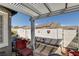 Backyard patio with a pergola, outdoor seating, and a water feature at 420 Blush Creek Pl, Las Vegas, NV 89144