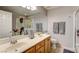 Bathroom featuring double sinks, a large mirror, and walk-in shower at 420 Blush Creek Pl, Las Vegas, NV 89144