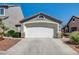 Charming single-story home with a two-car garage and well-maintained landscaping at 420 Blush Creek Pl, Las Vegas, NV 89144