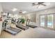 Bright gym with treadmills, a mirrored wall, and access to the community pool area at 420 Blush Creek Pl, Las Vegas, NV 89144