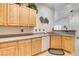 Spacious kitchen featuring granite countertops, stainless appliances, and breakfast bar seating at 420 Blush Creek Pl, Las Vegas, NV 89144