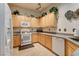 Kitchen with granite countertops, stainless steel appliances, and ample cabinet space at 420 Blush Creek Pl, Las Vegas, NV 89144