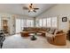 Spacious living room features a large sectional couch and plenty of natural light at 420 Blush Creek Pl, Las Vegas, NV 89144