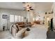 Bright living room with open layout connecting to dining area and kitchen at 420 Blush Creek Pl, Las Vegas, NV 89144