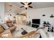 Bright living room with open layout connecting to dining area and kitchen at 420 Blush Creek Pl, Las Vegas, NV 89144