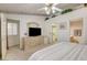 Spacious bedroom with ceiling fan, dresser, and closet at 420 Blush Creek Pl, Las Vegas, NV 89144