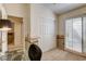 Room staged as an office with a white closet and window at 420 Blush Creek Pl, Las Vegas, NV 89144