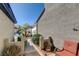 Side yard with desert landscaping, seating, and PODS in the background at 420 Blush Creek Pl, Las Vegas, NV 89144