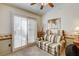 Relaxing sitting area with a patterned sofa and shutters at 420 Blush Creek Pl, Las Vegas, NV 89144