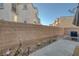 Cozy backyard patio area featuring desert landscaping and a privacy wall, perfect for relaxing outdoors at 4833 Integrity St, North Las Vegas, NV 89031