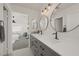 Modern bathroom features a double vanity with sleek fixtures and patterned tile flooring at 4833 Integrity St, North Las Vegas, NV 89031