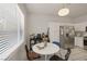 Bright dining area with a round table and stainless steel appliances at 4833 Integrity St, North Las Vegas, NV 89031