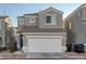 Charming two-story home featuring a two-car garage, tile roof, and low maintenance desert landscaping at 4833 Integrity St, North Las Vegas, NV 89031