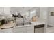 Kitchen area featuring a stainless steel dishwasher and double sink with stylish faucet at 4833 Integrity St, North Las Vegas, NV 89031