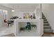 Bright, eat-in kitchen featuring white cabinetry, modern appliances, and a functional breakfast bar at 4833 Integrity St, North Las Vegas, NV 89031