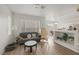 Bright living room featuring modern furniture, hardwood floors, and large windows for ample light at 4833 Integrity St, North Las Vegas, NV 89031