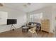 Cozy living room area with sleek wood floors, natural light, and comfortable modern furnishings at 4833 Integrity St, North Las Vegas, NV 89031