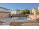 Community pool offers a refreshing escape in a well-maintained outdoor setting with beautiful landscaping and surrounding residential buildings at 4833 Integrity St, North Las Vegas, NV 89031