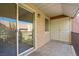 Cozy balcony featuring a sliding glass door, white stucco walls, and covered storage at 5060 Indian River Dr # 382, Las Vegas, NV 89103