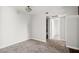 Neutral bedroom with carpet floors, white walls, and a bathroom entrance, creating a serene and adaptable living space at 5060 Indian River Dr # 382, Las Vegas, NV 89103