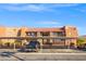 Apartment complex exterior featuring covered parking and desert landscaping under a clear blue sky at 5060 Indian River Dr # 382, Las Vegas, NV 89103