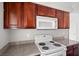 Close-up of the kitchen featuring a stove, microwave, and countertops, for cooking and convenient meal preparation at 5060 Indian River Dr # 382, Las Vegas, NV 89103