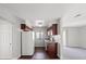 Cozy kitchen featuring wood cabinets, white appliances, and a window for natural light, perfect for easy meal preparation at 5060 Indian River Dr # 382, Las Vegas, NV 89103