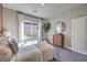 Serene bedroom featuring plush carpet, natural lighting, and stylish decor at 510 Copper Falcon Ave, Henderson, NV 89011