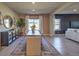 Dining area with a wooden table, modern decor, and a view into the cozy living space at 510 Copper Falcon Ave, Henderson, NV 89011