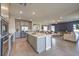 Stylish kitchen showcasing stainless steel appliances, a central island with seating, and seamless integration with living areas at 510 Copper Falcon Ave, Henderson, NV 89011