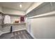 Walk-in closet featuring carpeted floors and wooden shelving with hanging clothes at 510 Copper Falcon Ave, Henderson, NV 89011