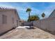 View of backyard featuring a patio and privacy wall with some landscaping at 5541 Ramirez St, North Las Vegas, NV 89031