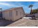 View of backyard featuring a patio, privacy wall, landscaping, and home exterior at 5541 Ramirez St, North Las Vegas, NV 89031