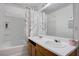 Bathroom featuring a tub and shower combination, double sinks and a large mirror at 5541 Ramirez St, North Las Vegas, NV 89031