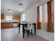 Cozy dining area adjacent to the kitchen, featuring tile flooring and lots of light at 5541 Ramirez St, North Las Vegas, NV 89031