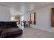 Open concept living area with tile floors, a dining table and a comfortable sofa at 5541 Ramirez St, North Las Vegas, NV 89031