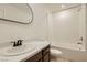 Well-lit bathroom featuring a sleek, modern sink and a clean, functional shower-tub combination at 5606 Spring Trellis St, Las Vegas, NV 89113