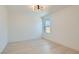 A sunny bedroom featuring hardwood floors and a stylish modern light fixture at 5606 Spring Trellis St, Las Vegas, NV 89113