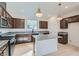 Stylish kitchen featuring stainless steel appliances, granite countertops, and an island at 5606 Spring Trellis St, Las Vegas, NV 89113