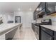 Open kitchen featuring stainless steel appliances, ample counter space, and center island at 5745 Becklow Gardens Ave, Las Vegas, NV 89141