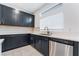 Stylish kitchen with stainless steel dishwasher, lots of cabinet space and modern countertops at 5745 Becklow Gardens Ave, Las Vegas, NV 89141