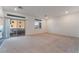 Bright living room with neutral carpet, recessed lighting, and sliding glass door at 5745 Becklow Gardens Ave, Las Vegas, NV 89141