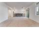 Bright living room with neutral carpet, modern electric fireplace and sliding glass door at 5745 Becklow Gardens Ave, Las Vegas, NV 89141