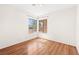 Bright bedroom featuring wood-look floors and double corner windows at 6130 Desert Sun Dr, Las Vegas, NV 89110